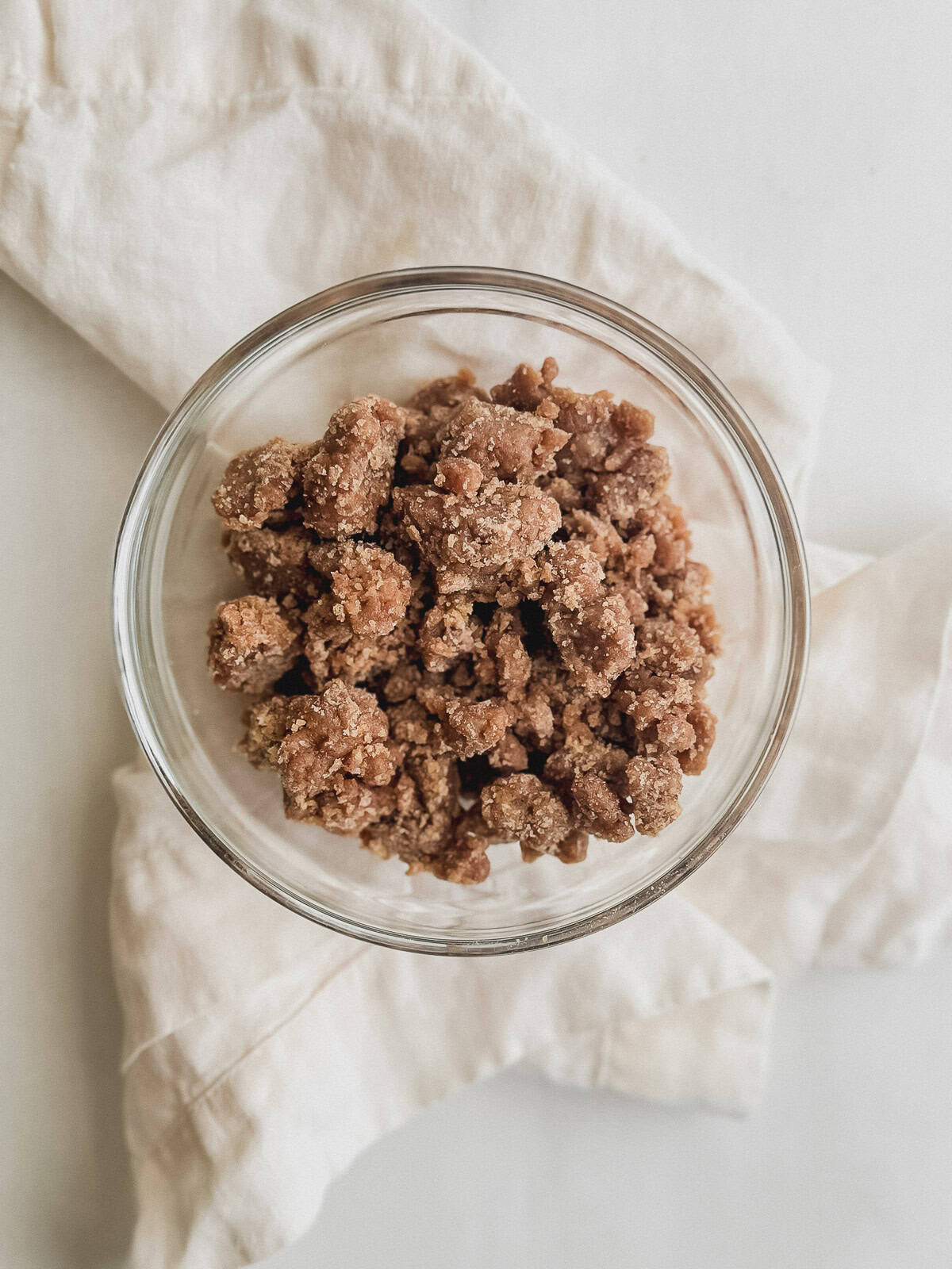 Small bowl filled with streusel topping.