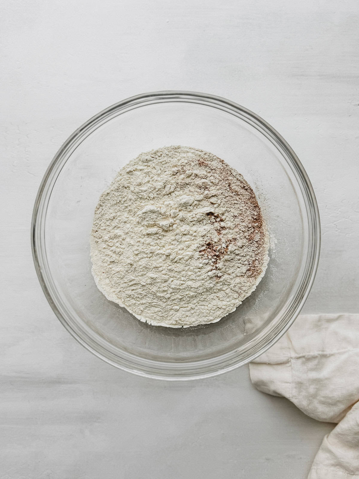 A mixing bowl with sifted dry ingredients.