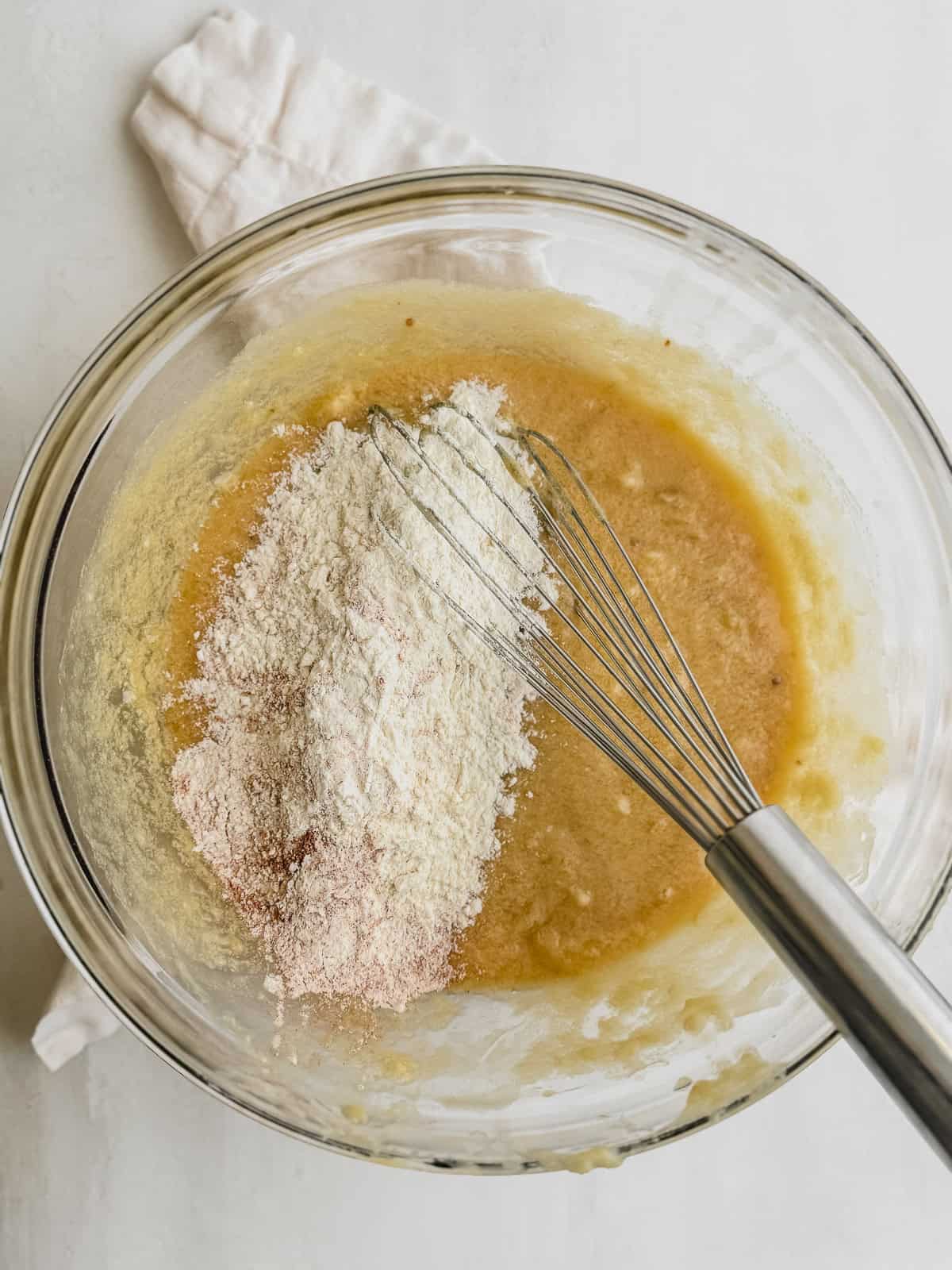 Dry ingredients added to banana bread batter.